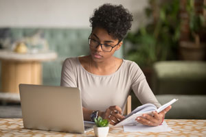 student studying with laptop